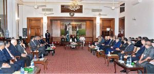 President Dr. Arif Alvi chairing a meeting with representatives of banking industry to review progress on initiatives for financial inclusion, gender equality and issues of banking sector at Sindh Governor House