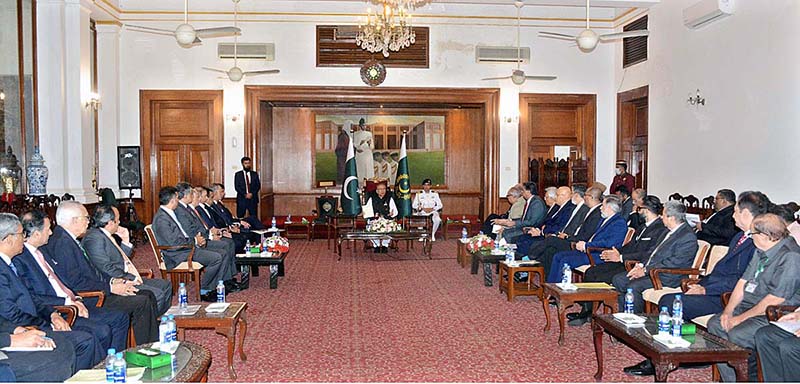 President Dr. Arif Alvi chairing a meeting with representatives of banking industry to review progress on initiatives for financial inclusion, gender equality and issues of banking sector at Sindh Governor House