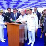 Prime Minister Muhammad Shehbaz Sharif, Türkiye's Vice President Cevdet Yilmaz and Chief of Naval Staff Admiral Muhammad Amjad Khan Niazi applaud after cutting a rope to launch Pakistan's 4th MILGEM Class Corvette"PNS Tariq" into sea at Karachi Shipyard & Engineering Works