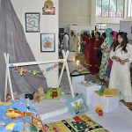 Students visiting stalls during 13th Thesis Display of School of Arts and Designing at National Textile University (NTU)
