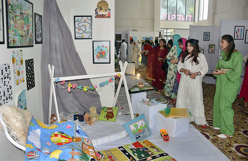 Students visiting stalls during 13th Thesis Display of School of Arts and Designing at National Textile University (NTU)