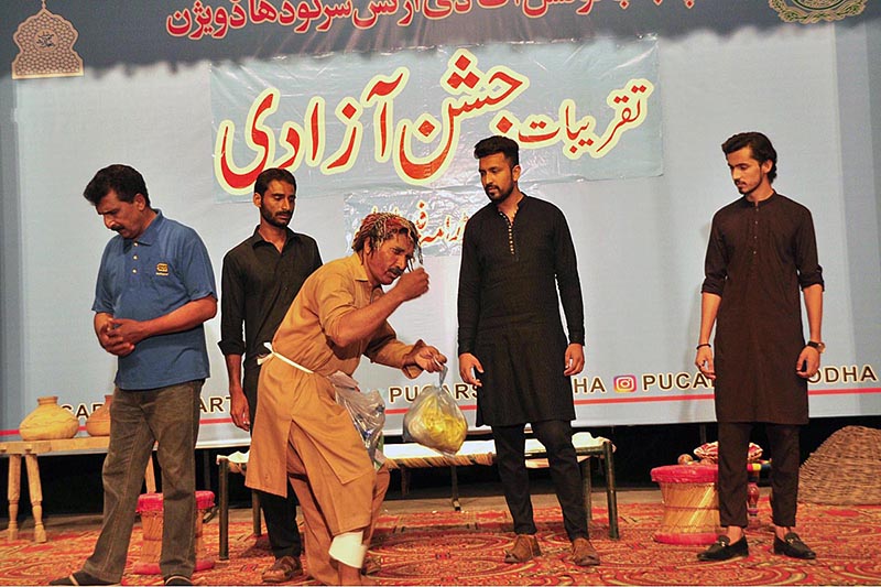 Artists performing on stage during drama titled (tota Jannat da) in connection with Independence Day organized by Sargodha Arts Council