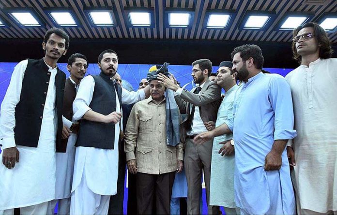 President of Pakistan Youth Parliament and Pakistan Youth Council presenting traditional Khyber Pakhtunkhwa turban to Prime Minister Muhammad Shehbaz Sharif at the launching ceremony of Prime Minister's Digital Youth Hub President of Pakistan Youth Parliament and Pakistan Youth Council presenting traditional Khyber Pakhtunkhwa turban to Prime Minister Muhammad Shehbaz Sharif at the launching ceremony of Prime Minister's Digital Youth Hub