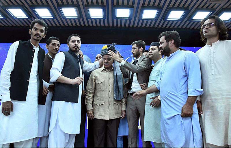 President of Pakistan Youth Parliament and Pakistan Youth Council presenting traditional Khyber Pakhtunkhwa turban to Prime Minister Muhammad Shehbaz Sharif at the launching ceremony of Prime Minister's Digital Youth Hub