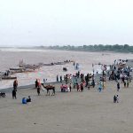 Large number of people enjoying at bank of Indus river at Jamshoro