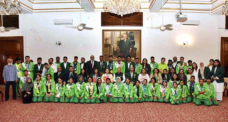 President Dr. Arif Alvi, and Begum Samina Arif Alvi, in a group photo with Special Olympics Pakistan delegation World Summer Games Berlin 2023 at Governor House