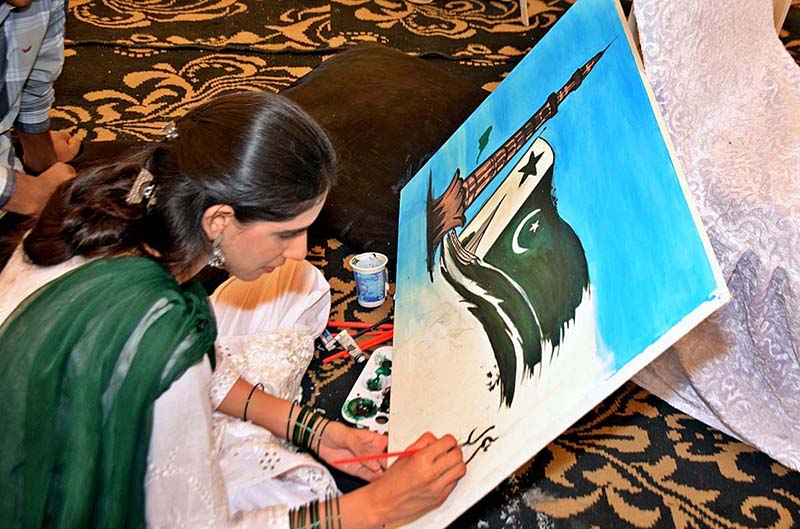 Student giving Final touches to her painting during Independence Day Painting Competition
