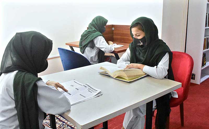 Students studying in the newly inaugurated Public Library at Women Degree College
