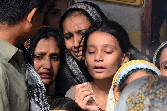 Relatives are sad for 72 years lady Sharifa for a train accident victim after the derailment of a passenger train in Nawabshah at phuleli bazar atleast 35 people were killed in Hazara express