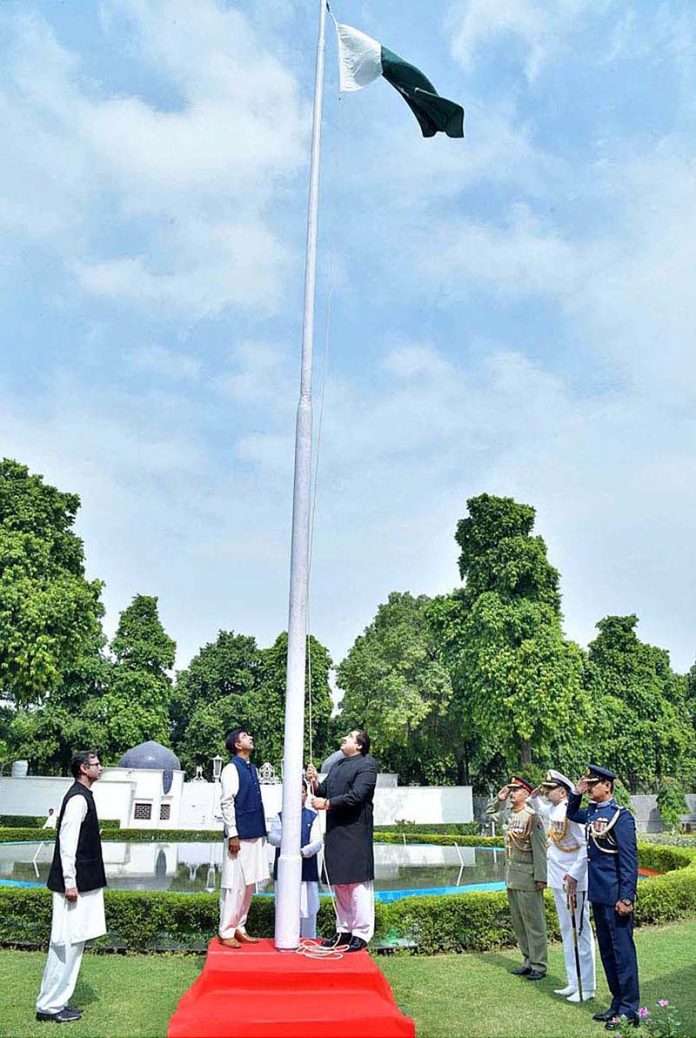 Aizaz Khan, charge d'' Affaires hoisting National flag to mark the 76th anniversary of Independence Day of Pakistan at Pakistan High Commission