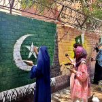 Student Painters giving final touch to their artwork on wall for upcoming Defence Day at Alhamra Cultural Complex Gaddafi Stadium
