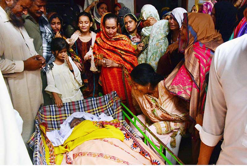Relatives are sad for 72 years lady Sharifa for a train accident victim after the derailment of a passenger train in Nawabshah at phuleli bazar atleast 35 people were killed in Hazara express