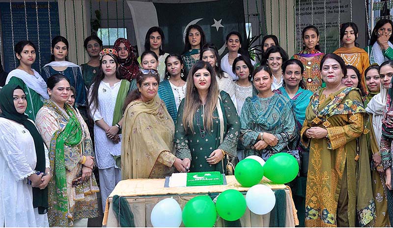 Professor Dr. Fariha Nighat along with the Students cutting cake on the occasion of 77th Independence Day celebration at Government College for Women Dhoke Elahi Bakhsh