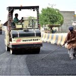 Laborers busy in construction work of Mohen-jo-Daro Airport Road during development work in the city
