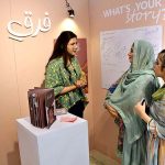 Student from department of Graphic Design Lahore College Women University are briefing the visitors about the Cordeli Degree Show 2023 BFFA Graphic Design at Alhamra Art Gallery