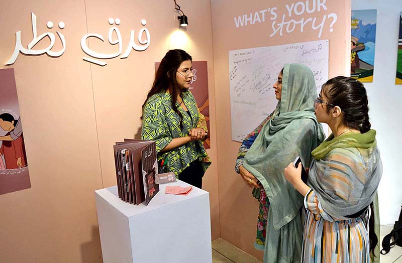 Student from department of Graphic Design Lahore College Women University are briefing the visitors about the Cordeli Degree Show 2023 BFFA Graphic Design at Alhamra Art Gallery