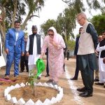 First Lady Begum Samina Arif Alvi along with President Dr. Arif Alvi watering a Mango sapling after planting at Mizar-e-Quaid