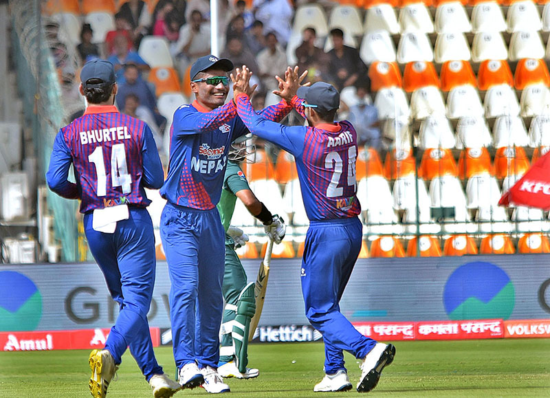 Nepal team players celebrating after taking the wicket of Pakistan's batsman Fakhar Zaman during the First cricket match of Asia Cup 2023 between Pakistan and Nepal at Multan Cricket Stadium.