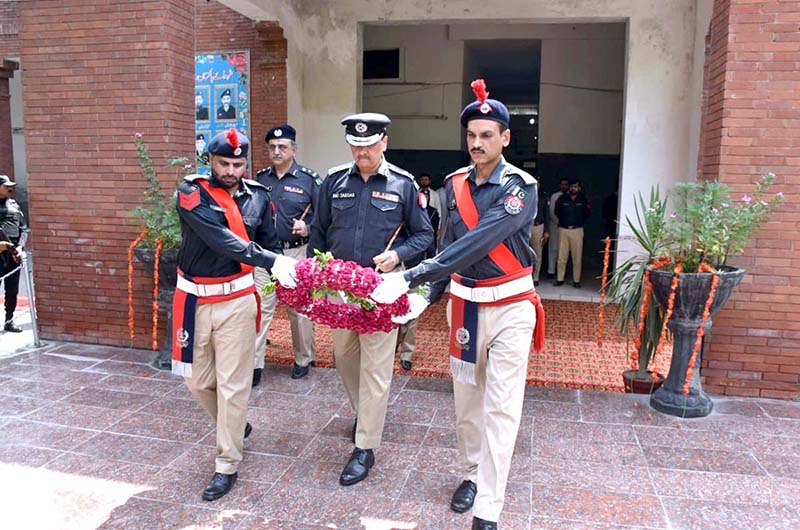 IG Railways Police Rao Sardar Ali Khan pays tribute to the fallen heroes of Railways Police on Police Martyrs Day, offering a respectful bouquet in their honor