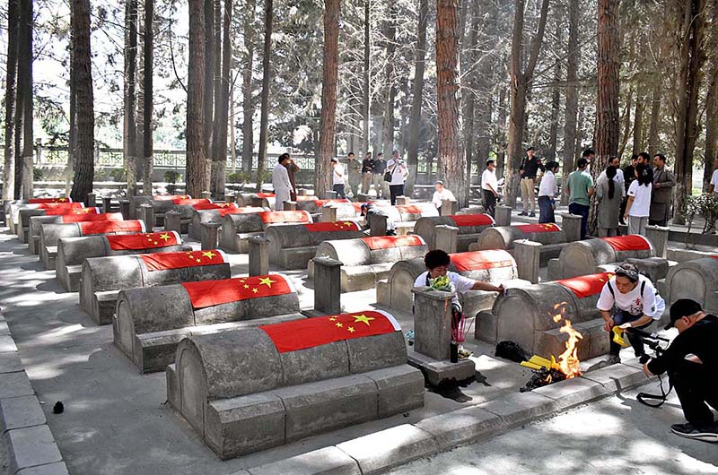 Chinese delegation paying tribute to their relatives who loss their lives during the construction of Karakoram Highway (1959-77) during their visit to Chinese Graveyard Daniyor