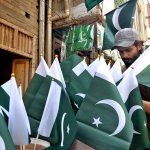 Vendor selling flags and other stuff related to Independent Day at Jail Road.