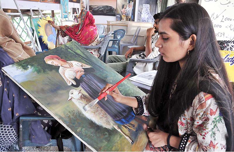 Student giving final touch to her painting in the training class at Peshawar Morr Weekly Bazar Student giving final touch to her painting in the training class at Peshawar Morr Weekly Bazar