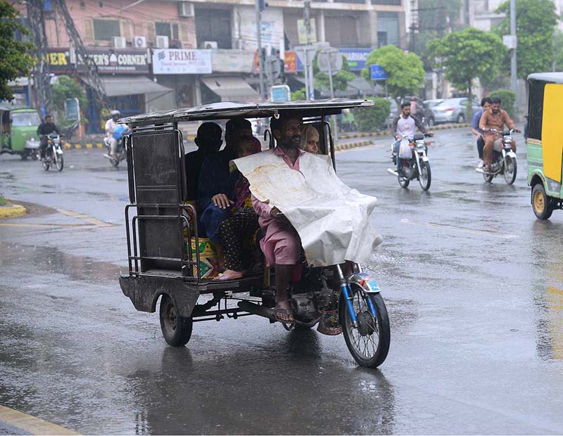 Vehicles on their way after rain in the provincial capital