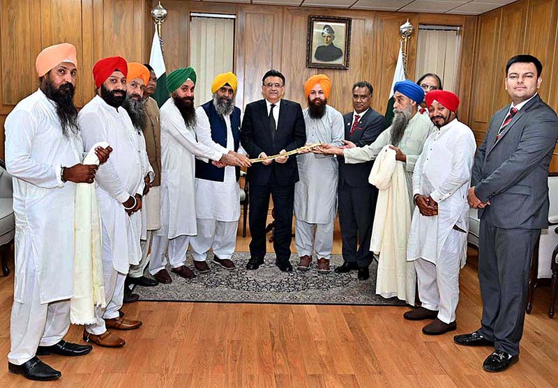 A delegation of Minorities representatives presenting a souvenir to the Hon'ble Chief Justice of Pakistan Mr. Justice Umar Ata Bandial at the Supreme Court of Pakistan