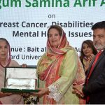 Begum Samina Arif Alvi is being presented with memento during the interactive dialogue Session on Breast Cancer Awareness, Mental Health and Inclusion of Differently Abled Persons organized by World Health Organization, at Hamdard University