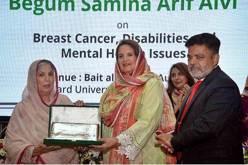 Begum Samina Arif Alvi is being presented with memento during the interactive dialogue Session on Breast Cancer Awareness, Mental Health and Inclusion of Differently Abled Persons organized by World Health Organization, at Hamdard University