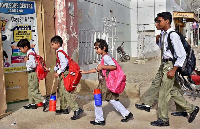 Students are going to their school for the first day after the summer vacation