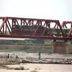 A passenger train on the way passing through Kotri Railway Bridge