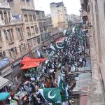 A large Number of People buying national flags and other items ahead of Independence Day at Paper Market.