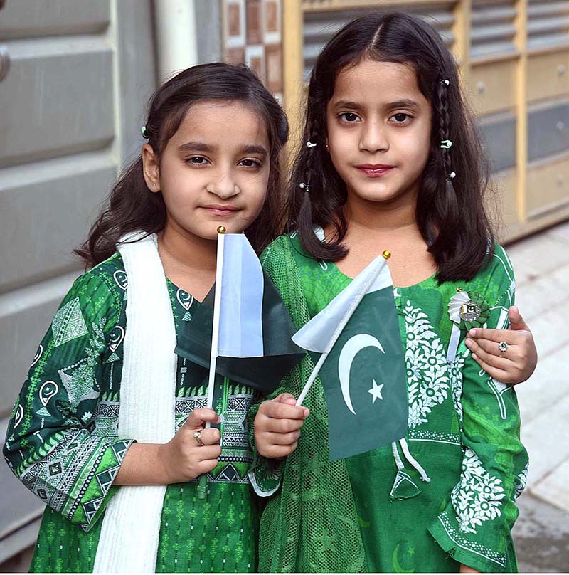 Children are reciting the National anthem and waving the National flag during Flag hoisting ceremony at Punjab Assembly on the occasion of 77th Independence Day celebration
