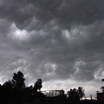 A view of dark clouds hovering over the city before rain