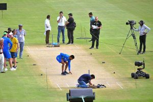 Pakistan Cricket team captain Babar Azam examines the pitch ahead of the first cricket match of Asia Cup 2023 at Multan Cricket Stadium