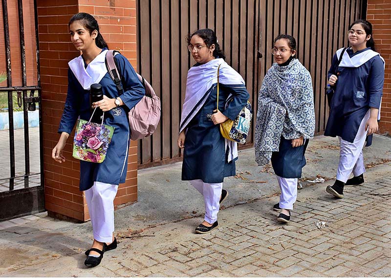 Students are going to their school for the first day after the summer vacation