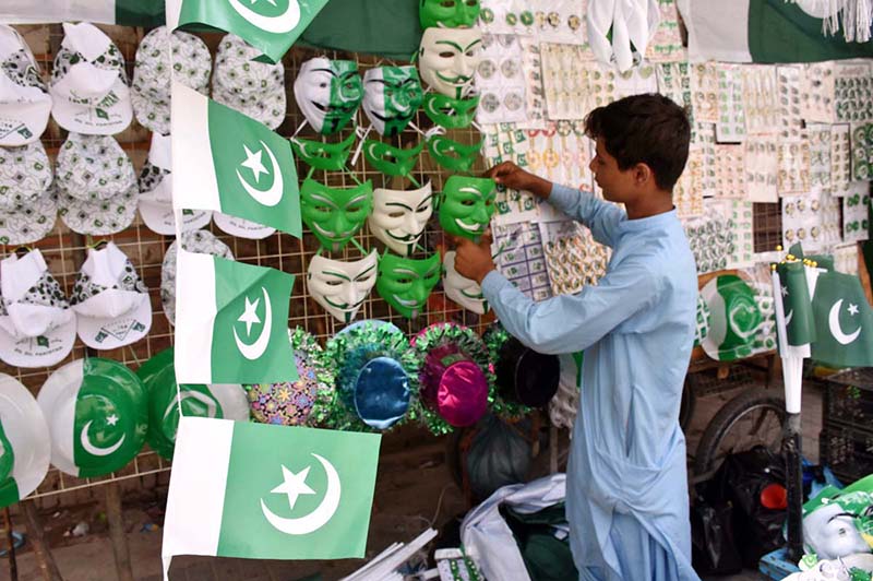 A vendor displaying national flag and other stuff to attract the customers in connection with upcoming Independence Day celebrations