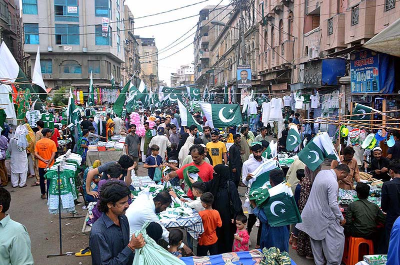 A large Number of People buying national flags and other items ahead of Independence Day at Paper Market