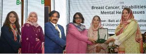 Begum Samina Arif Alvi is being presented with memento during the interactive dialogue Session on Breast Cancer Awareness, Mental Health and Inclusion of Differently Abled Persons organized by World Health Organization, at Hamdard University