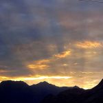 An attractive and eye catching view of sun ray peeping from the clouds during sunset