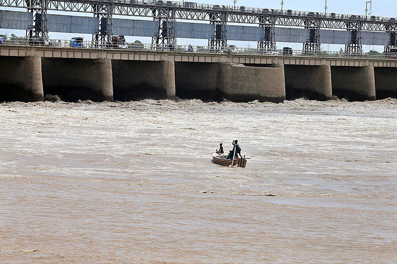 Fisherman catching the fish on their boat at Indus river