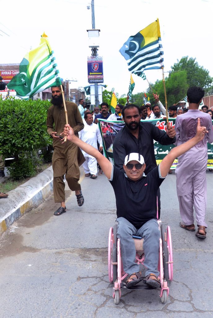 A disabled person participating in a rally to mark the Kashmir Day of Exploitation