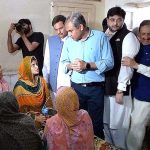 Punjab Chief Minister Syed Mohsin Naqvi is distributing supplies during his visit Danish School Camp regarding the incident Christian Colony Jaranwala