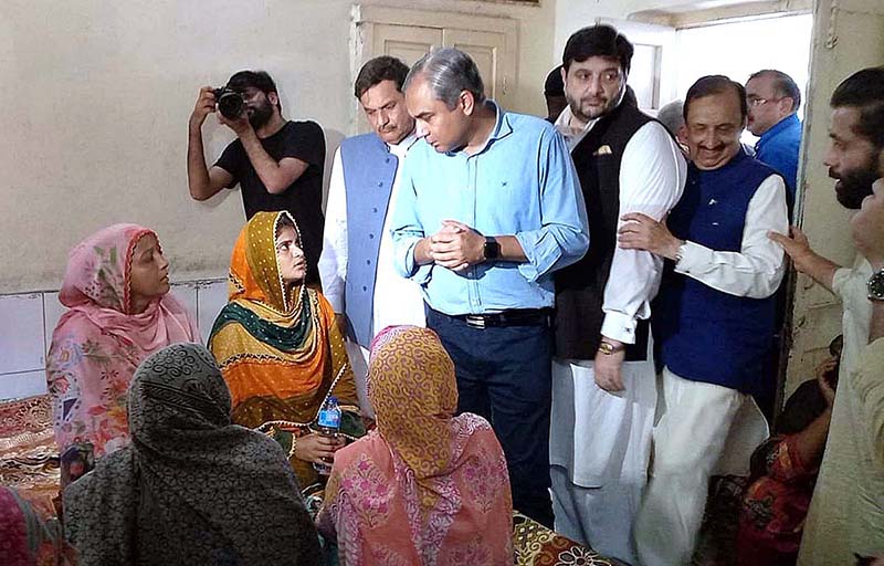 Punjab Chief Minister Syed Mohsin Naqvi is distributing supplies during his visit Danish School Camp regarding the incident Christian Colony Jaranwala