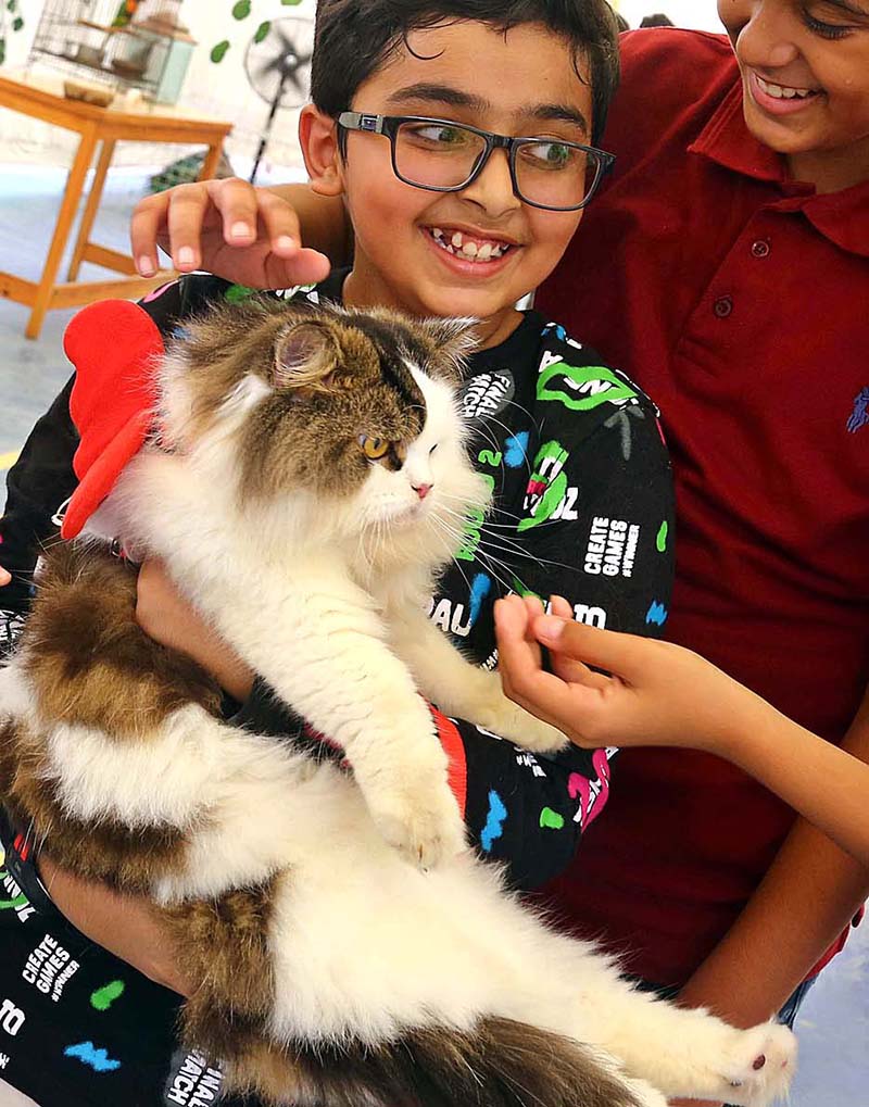 Participant poses with their pets during Pet Show organized at International School Clifton