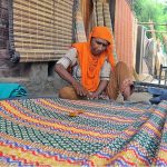 A lady preparing Curtin (Chik) at his roadside setup to earn for livelihood