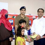 DC Attock Rao Atif Raza presenting flowers and funds to the families of the martyrs on the occasion of Martyrs Day ceremony at Police Line