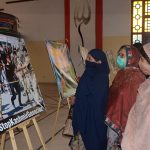 Women taking keen interest during painting exhibition to mark the Kashmir Day of Exploitation organized by the Arts Council