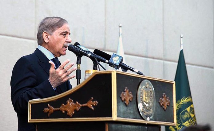 Prime Minister Muhammad Shehbaz Sharif addressing a ceremony of distribution of certificates of appreciation among the staff of PM Office and PM House